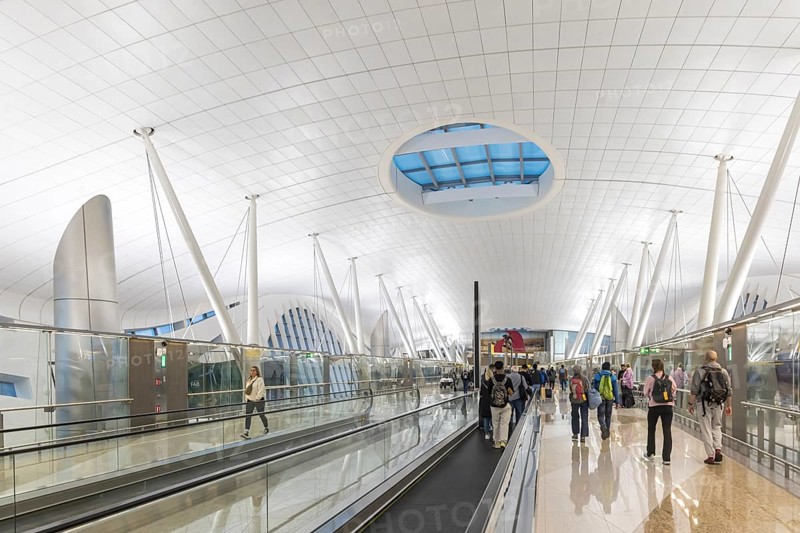Abu Dhabi Airport, Zayed International Airport with passengers. The new Terminal A has a capacity of 45 million passengers per year. Modern architecture. Abu Dhabi, United Arab Emirates, UAE, Asia