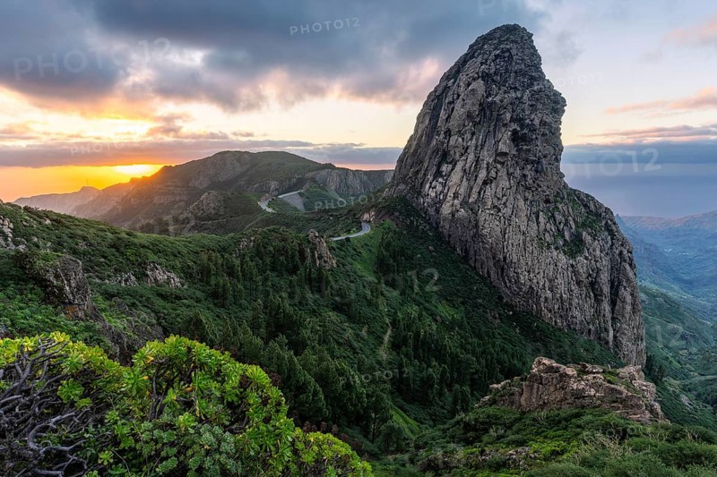 View of the Roque de Agando rock tower, one of La Gomera's landmarks, from the Mirador Roque de Agando. Sunrise, good weather. Monumento Natural de Los Roques, La Gomera, Canary Islands, Spain, Europe