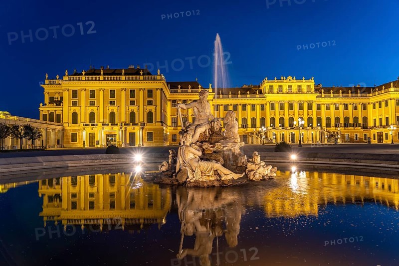 Fountain in the courtyard of honour at Schönbrunn Palace at dusk, UNESCO World Heritage Site in Vienna, Austria, Europe
