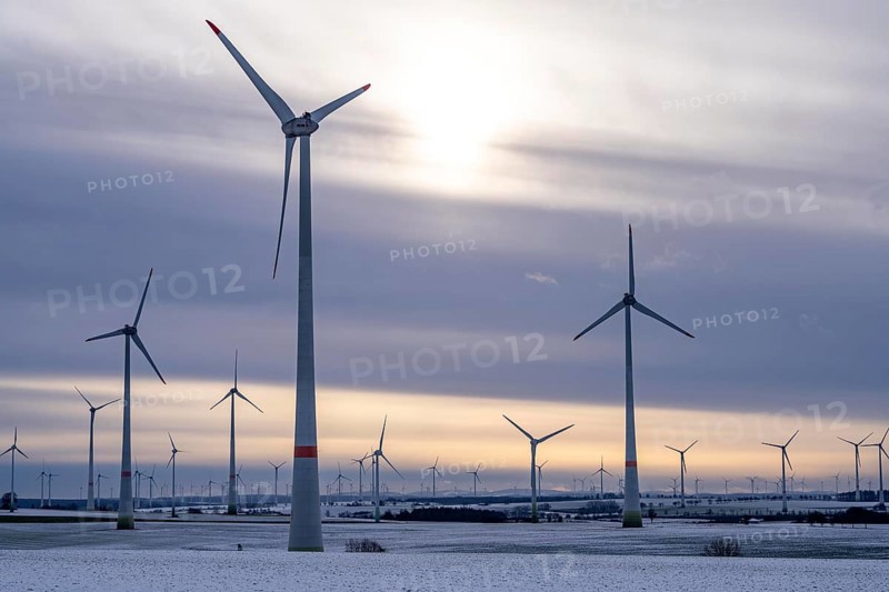 Wind farm, north of Lichtenau, self-proclaimed energy town, over 190 wind turbines and over 1200 solar panels generate 10 times as much electricity as the community of 11, 900 inhabitants consumes, largest onshore cluster of wind turbines in Germany, winter, slightly snow-covered landscape, North Rhine-Westphalia, Germany, Europe