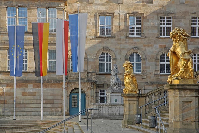 Town hall built in 1909 with flags and two golden lion figures, EU flag, German national flag, Hessian state flag and city flag, flags, historicism, golden, lion figure, Obere Königsstraße, Kassel, Hesse, Germany, Europe