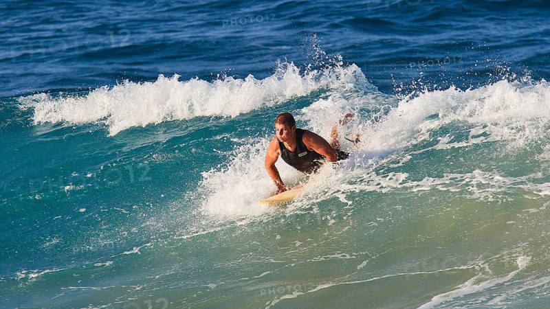 Surfer fights against the powerful waves in the blue ocean, wave surfer, surfer, surf, waves, west coast, Arkasa, Karpathos, Dodecanese, Greek Islands, Greece, Europe