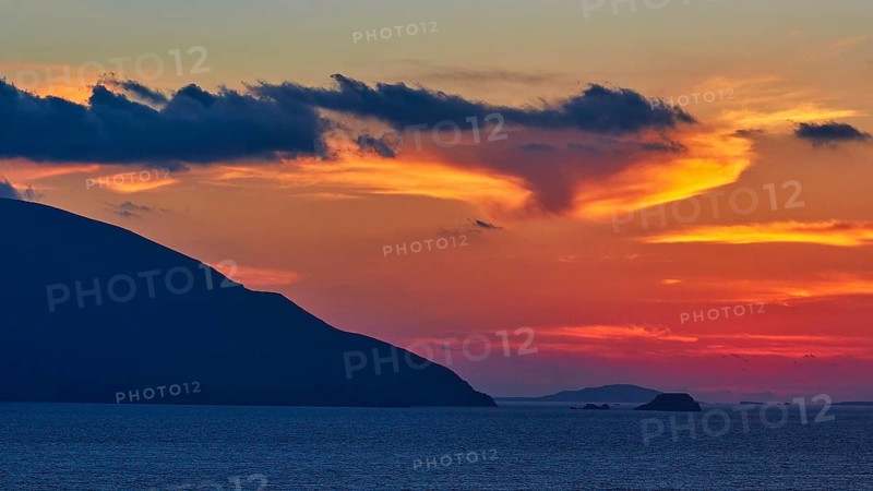 Play of colours in the evening sky over the sea, hills as silhouettes in front of a colourful sunset, sunset, Kassos, Karpathos, offshore islands, Dodecanese, Greek Islands, Greece, Europe