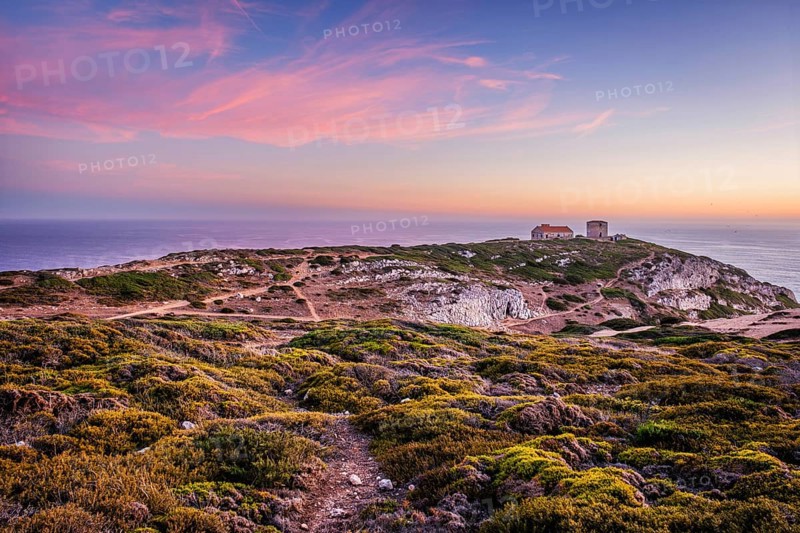 Cabo Espichel cape Espichel on Atlantic ocean at sunset with ruins