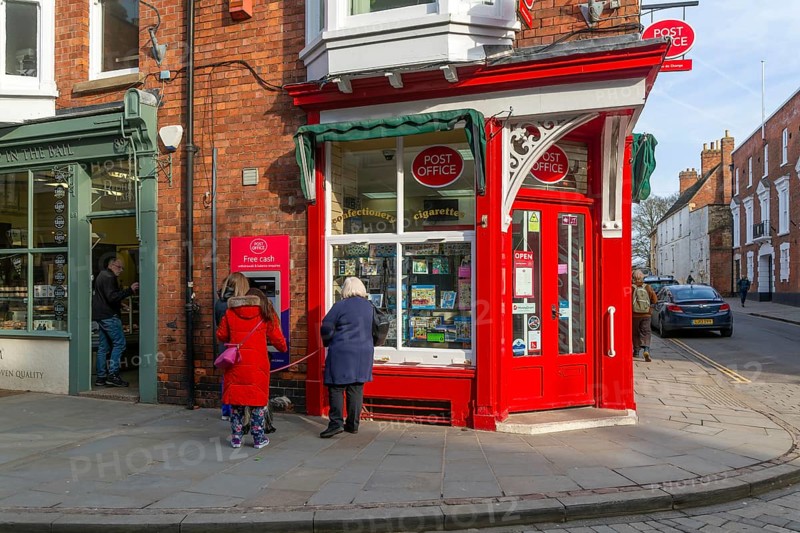 Post Office corner shop painted bright red, Eastgate, Bailgate, Uphill area of city of Lincoln, Lincolnshire, England, UK