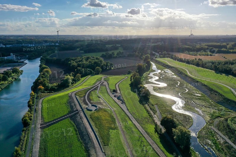 Recklinghausen, Castrop-Rauxel, North Rhine-Westphalia, Germany, Renaturalised Emscher, EMSCHERLAND construction project, a 37-hectare water and nature discovery park at the water crossroads of the Rhine-Herne Canal (left) and the renaturalised Emscher (right) on the city limits of Recklinghausen and Castrop-Rauxel. The ecological focal point at the confluence of Suderwicher Bach and Emscher will also be a future garden for the International Garden Exhibition 2027. Before the renaturalisation, the Emscher river system was an open, above-ground wastewater channel, combined sewer with surface water and wastewater, Europe