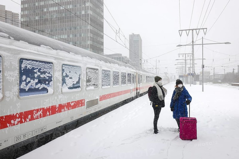 Essen, North Rhine-Westphalia, Germany - Onset of winter in the Ruhr area, Essen railway station, many trains delayed or cancelled due to ice and snow, passengers waiting for trains