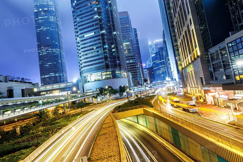 Hong Kong at night traffic with streets and skyscrapers in Hong Kong, China, Asia