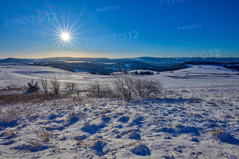 Snow-covered hills under a bright sun and clear sky, winter, Wasserkuppe, Gersfeld, Rhön, Hesse, Germany, Europe