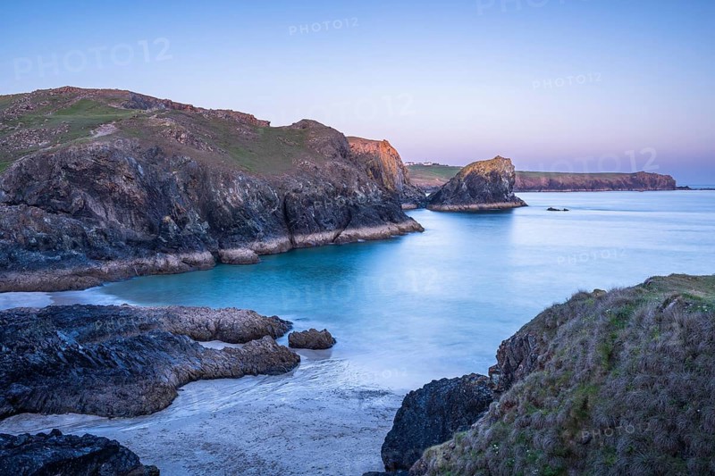 Coastal landscape in Kynance Cove. In the evening at sunset. Long exposure. Kynance Cove, Lizard Peninsula, Cornwall, England, Great Britain