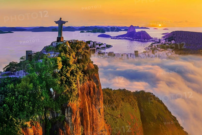 Corcovado 710m with Christ the Redeemer statue above Botafogo Bay with Sugar Loaf 396m at sunrise and morning fog, Rio de Janeiro, Brazil, South America