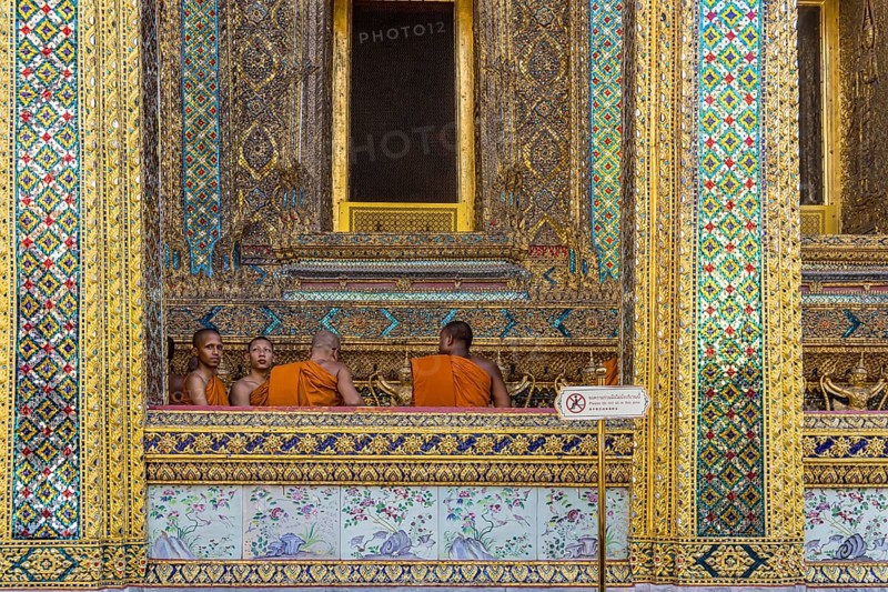 Wat Phra Kaeo temple, royal palace. Royal chapel with Buddhist monks and novices. Bangkok, Thailand, Asia