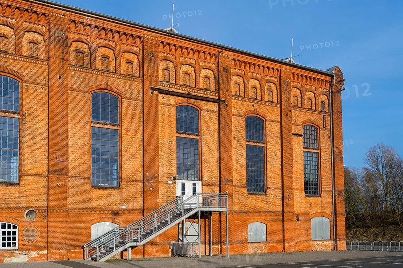 Brick building with large windows and metal staircase in front of a clear blue sky, blower hall, Ilseder Hütte, Ilsede, Peine, Lower Saxony, Germany, Europe