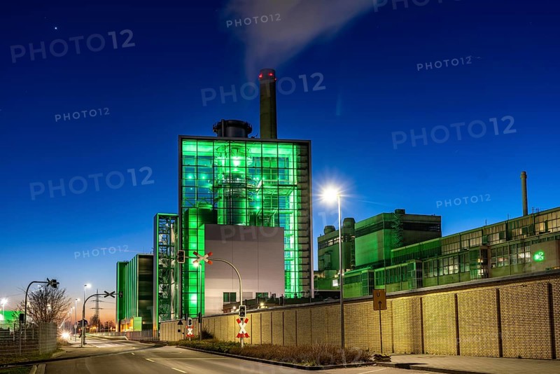 The Lausward combined heat and power plant in Düsseldorf, gas and steam turbine power plant, operated by Stadtwerke Düsseldorf and EnBW, in the harbour of Düsseldorf on the Rhine, green illuminated city window, the chimney of the Fortuna power plant unit, the power plant generates electricity, also traction current and district heating, North Rhine-Westphalia, Germany, Europe