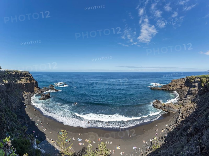 The lava beach lined with bathers, Playa del Bollulo, near Puerto de la Cruz, Tenerife, Canary Islands, Spain, Europe