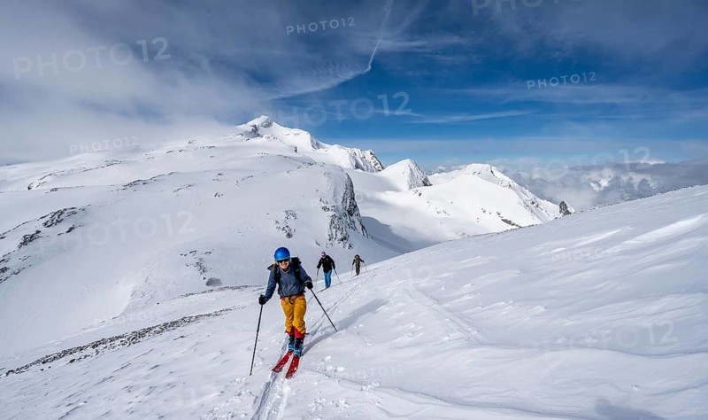 Group of ski tourers ascending the Schnidehorn, mountain landscape in winter, Wildhorn summit with Tungel glacier in the background, Bernese Alps, Switzerland, Europe