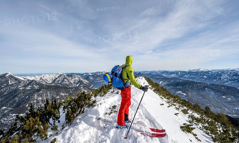 Ski tourer at the summit of Simetsberg, mountain panorama, Estergebirge, Bavarian Prealps, Bavaria Germany