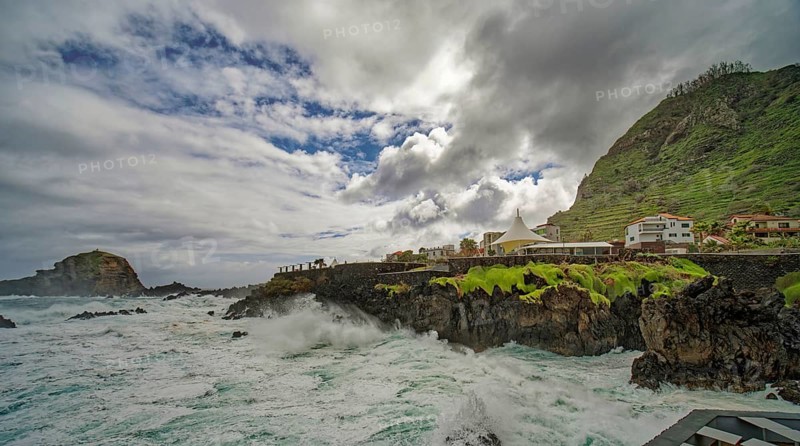 High waves on the rocks of Porto Moniz, surf on the Atlantic Ocean, storm, clouds, Porto Moniz, Madeira, Portugal, Europe