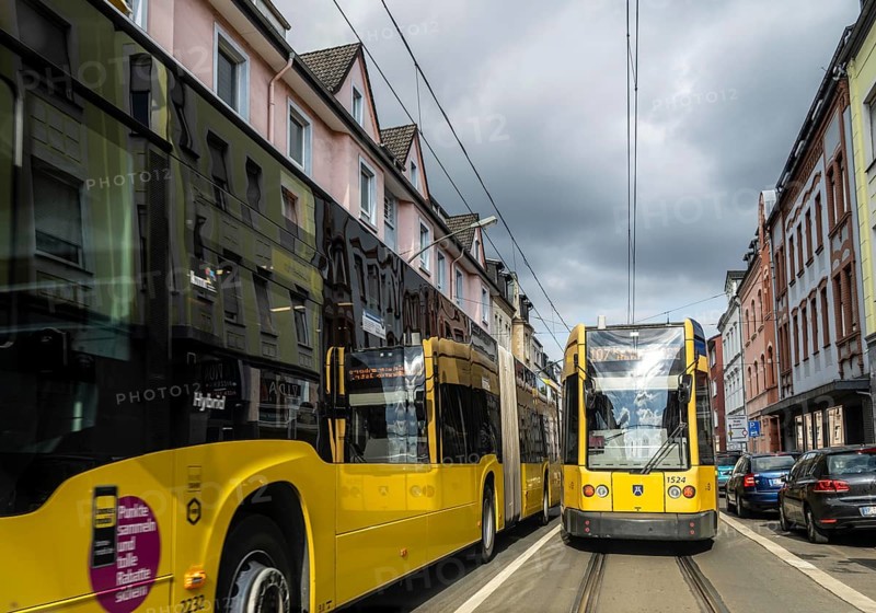 Tram and bus in traffic, on the street Schonnebeckhöfe in Essen-Katernberg, North Rhine-Westphalia, Germany, Europe