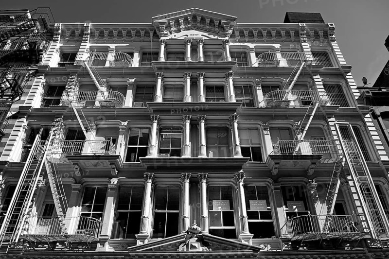 Neoclassical house facade with fire escapes, Downtown, New York City, USA, North America