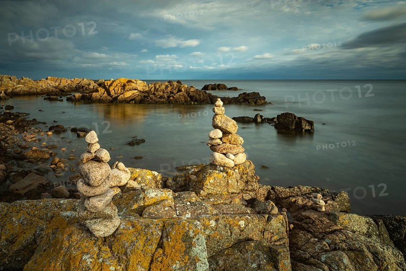 Rocky coast with cairns in the morning light, Allinge-Sandvig, Bornholm, Denmark, Europe