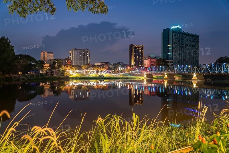 Chiang Mai skyline reflected in the Mae Nam Ping River at dusk, Chiang Mai, Thailand, Asia