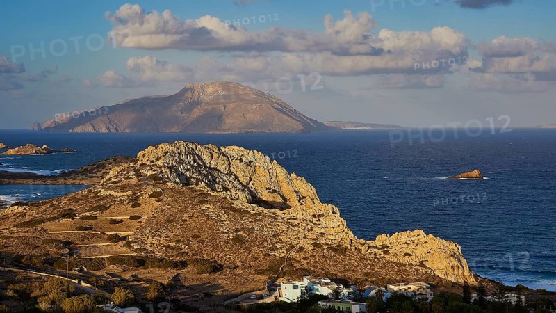 Coastal landscape with an island in the background and striking rock formations, Acropolis Hill, Arkasa, Kassos Island, West Coast, Karpathos, Dodecanese, Greek Islands, Greece, Europe