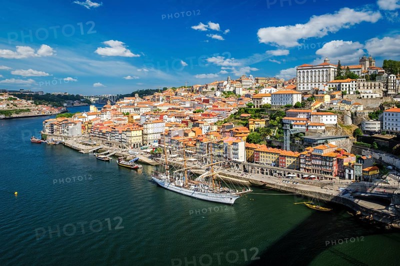 Aerial view of Porto city and Douro river with moored sailling ship from Dom Luis bridge I. Porto, Portugal, Europe