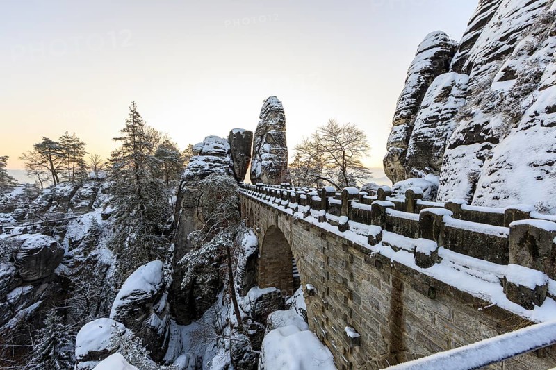 Snow on the Bastei bridge, rock gate and rock castle Neurathen in the morning, Saxon Switzerland, Saxony, Germany, Europe