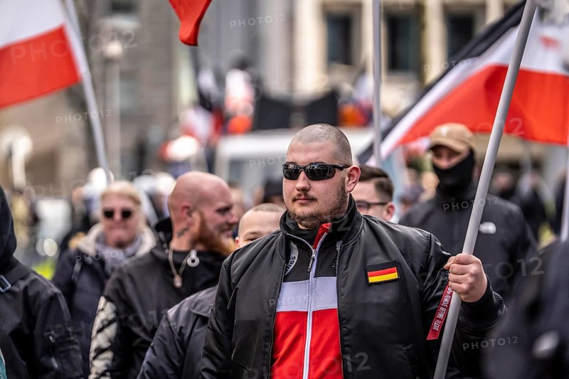 The neo-Nazi group Jung und Stark, JS, demonstrates in the city centre of Essen, demanding the remigration of foreigners, chanting Deutschland den Deutschen Ausländer raus, approx. 150 ultra right-wingers, dressed in black and wearing typical scene clothing, several groups demonstrate against the Nazi march, Essen, North Rhine-Westphalia, Germany, Europe