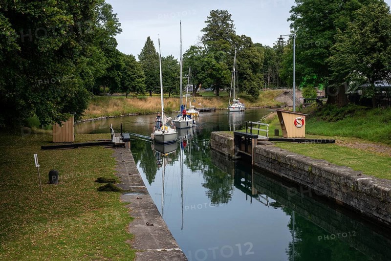 Lock in the Göta Canal. Göta Canal was built between 1810 and 1832 and runs right through Sweden. Together with the Trollhätte Canal and the Göta River, the Göta Canal forms a 390-kilometer-long waterway from the Baltic Sea to the Kattegat. Motala, Östergötland County, Sweden, Scandinavia, Europe