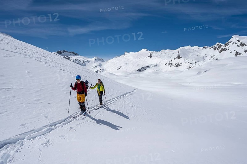 Ski tourers in a mountain landscape with snow, summit Wildhorn in the background, ascent to Wildstrubelhütte, Bernese Alps, Switzerland, Europe