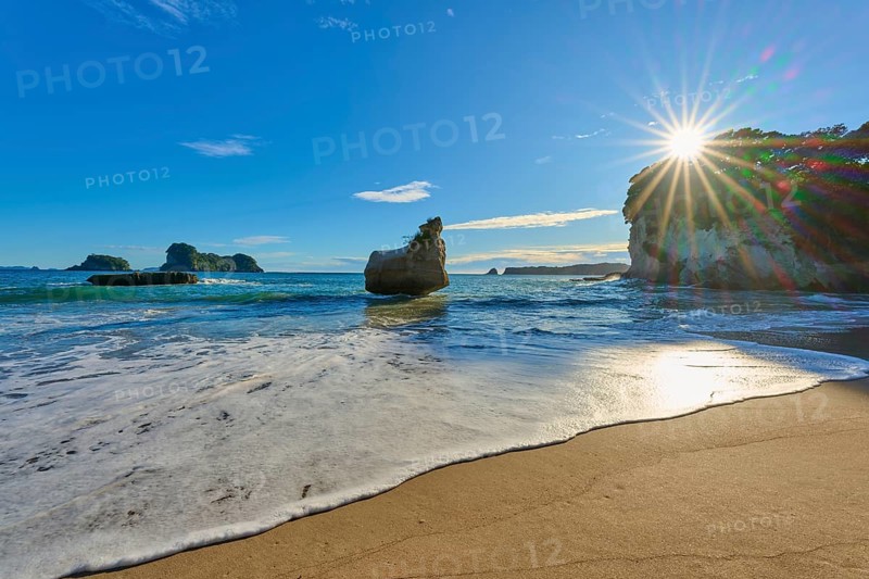 Rocky beach in clear weather with strong sunlight, Cathedral Cove, Coromandel, Canterbury, North Island, New Zealand, Oceania