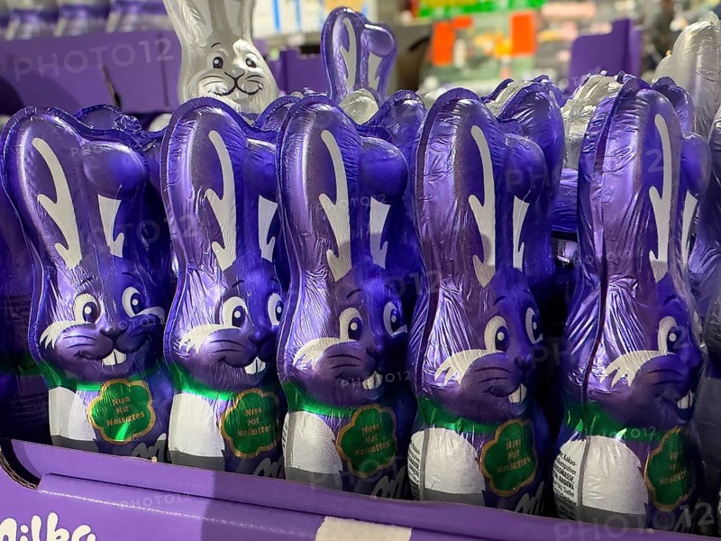 Display on retail shelf of wholesale chocolate Easter bunnies chocolate Easter bunnies wrapped in purple staniol paper, Germany, Europe
