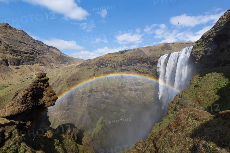Skógafoss is a waterfall situated on the Skógá River in the south of Iceland. Height 60 m, width 25 m. Rainbow over the waterfall