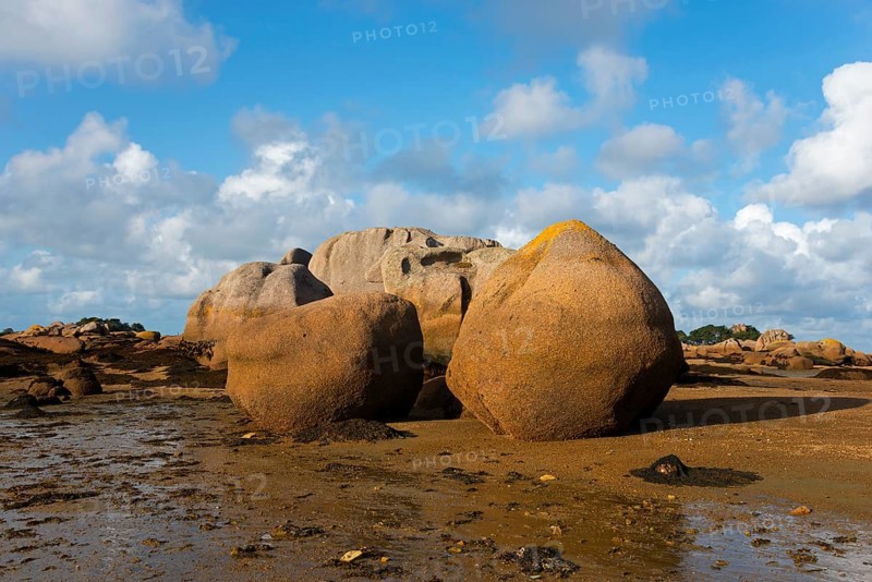 Rock formations under a bright blue sky on the coast, Baie de Sainte-Anne, Trégastel, Tregastel, Côte d'Armor, Brittany, France, Europe
