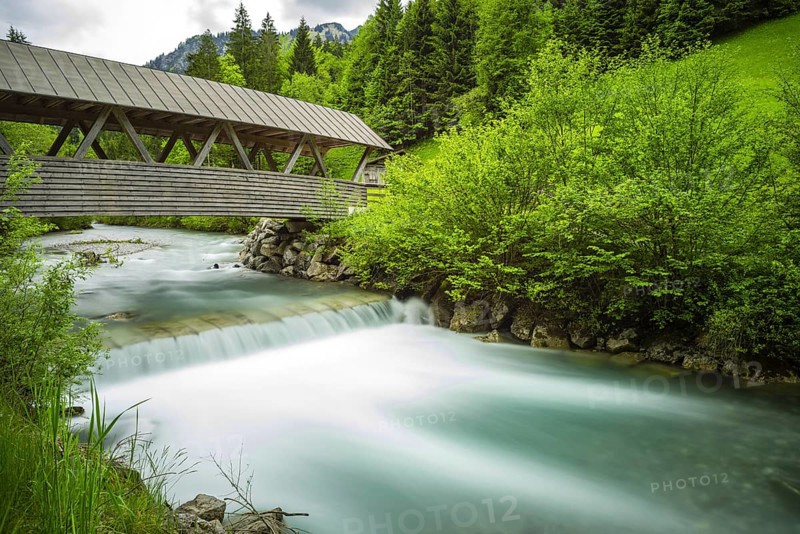 Covered wooden bridge over the Stillach, Stillachtal near Oberstdorf, Allgäu Alps, Allgäu, Bavaria, Germany, Europe