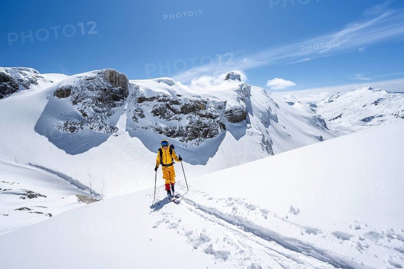 Ski tourer in mountain landscape with snow, ascent to Wildstrubelhütte, Bernese Alps, Switzerland, Europe