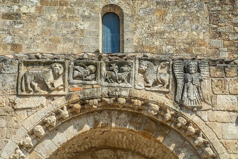 Old figures over the entrance to Minor Basilica and Sanctuary Maria SS. Regina di Anglona, Policoro, Matera, Basilicata, Italy, South Europe, Europe