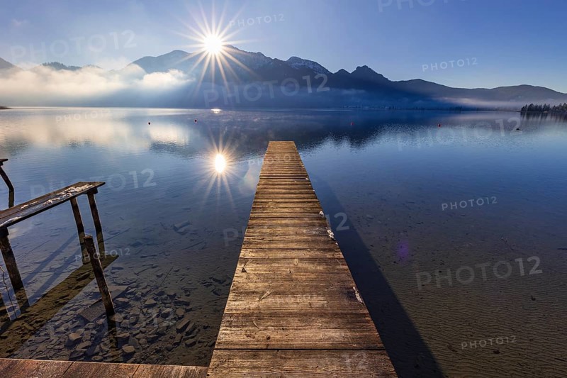Jetty, boat dock, lake, reflection, fog, sunbeams, backlight, winter, snow, ice, Lake Kochel, view of Herzogstand, Heimgarten, Alpine foothills, Bavaria, Germany, Europe