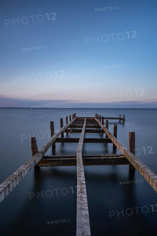 View of a partially dismantled jetty at Steinhuder Meer, long exposure, Wilhelmstein, Hagenburg Canal, lake, nature photo, landscape photography, drifting clouds, portrait format, wood, Hagenburg, Hanover region, Lower Saxony, Germany, Europe