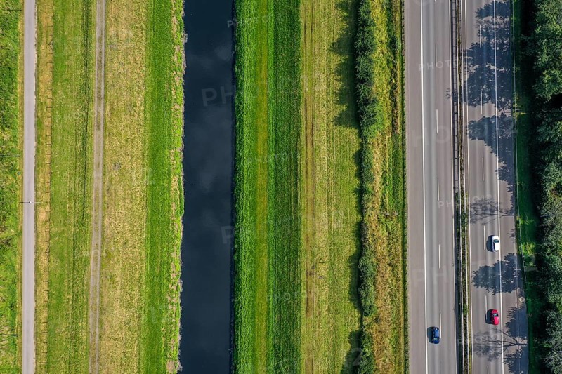 Bottrop, North Rhine-Westphalia, Germany - The Emscher has been completely free of wastewater since January 2022 following the construction of a parallel sewer. The river, here next to the A42 motorway, was previously an open, above-ground wastewater sewer, combined sewer with surface water and wastewater