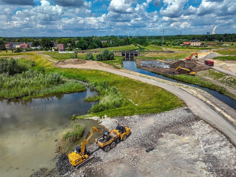 Dortmund / Castrop-Rauxel, North Rhine-Westphalia, Germany, renaturalisation of the Emscher, flood retention basin HRB Mengede. A new floodplain landscape for flood protection and biodiversity is being created at the Emscher-Auen farm. The Emscher, which is currently straightened, will be given curves again and can meander through its new floodplain. The Emscher has been completely free of sewage since 2022 following the construction of a parallel sewer. The river was previously an open, above-ground mixed water channel with rainwater and wastewater. The Uniper coal-fired power plant Datteln 4 in the background, Europe