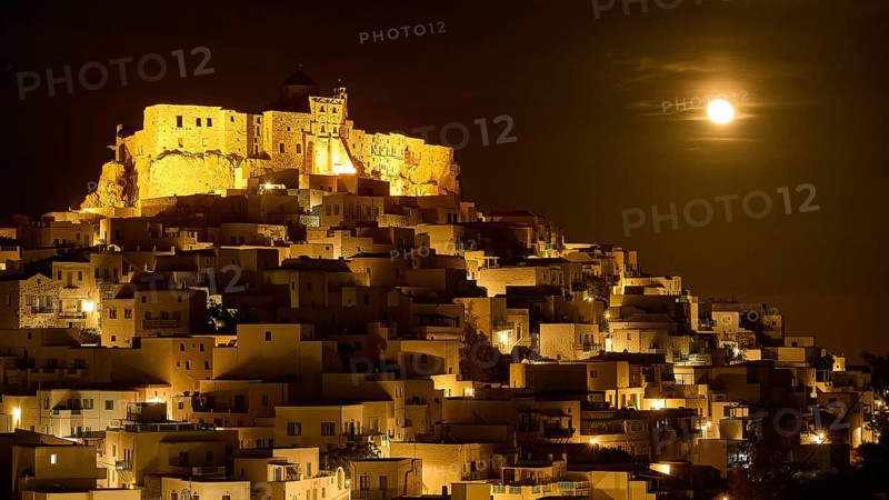 Full moon night over an illuminated settlement with castle, dramatic lighting, Querini Castle, Chora, Astypalea, Dodecanese, Greek Islands, Greece, Europe