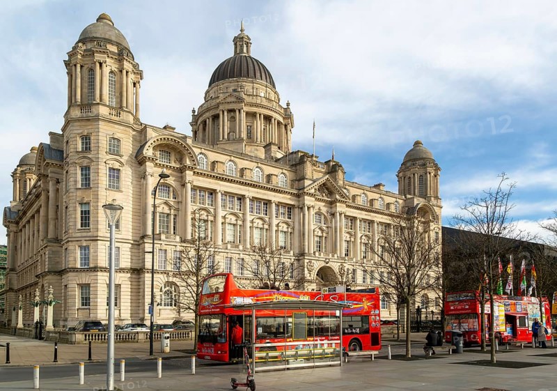 Port of LIverpool building, Pier Head, Liverpool, England, UK completed 1907 architect Sir Arnold Thornely red double-decker tour bus