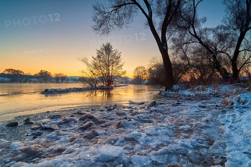 A frozen river in a wintry landscape at sunrise, Wörth am Main, Untermain, Main, Spessart, Odenwald, Bavaria, Germany, Europe