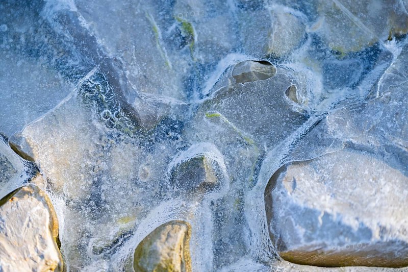 Close-up of stones in a frozen water, Bavaria, Germany, Europe