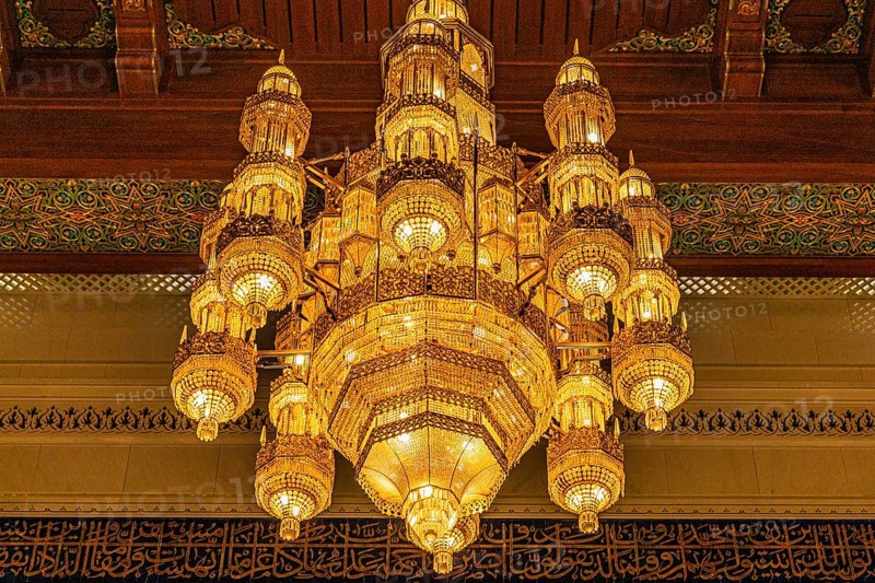 Illuminated chandelier in the Sultan Qaboos Mosque, Muscat, Arabian Peninsula, Sultanate of Oman