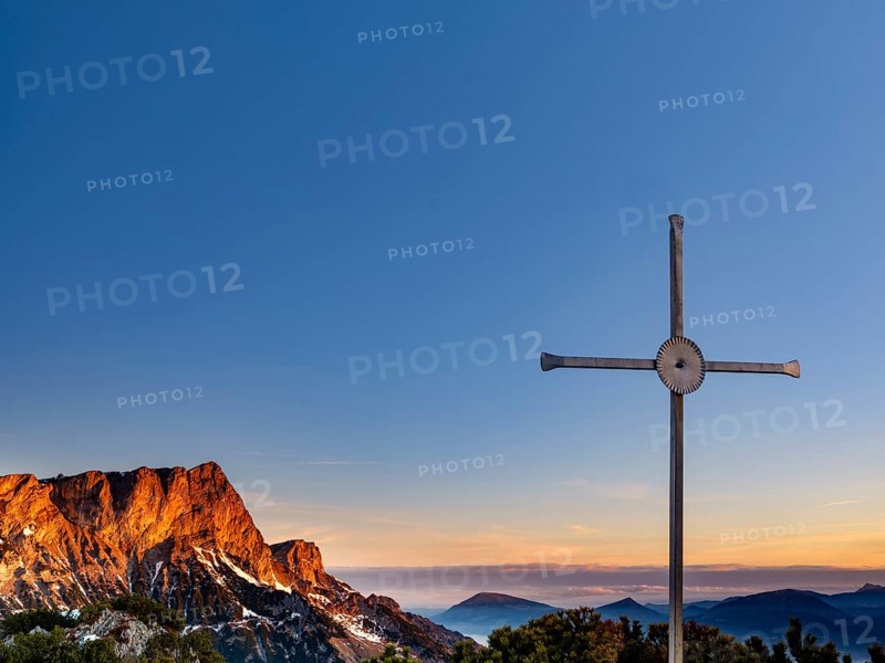 Sunrise at the summit cross of the Rauhen Kopf, behind the Untersberg, Berchtesgaden Alps, Bischofswiesen, Berchtesgadener Land, Upper Bavaria, Bavaria, Germany, Europe