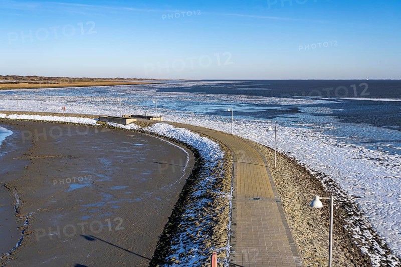 The East Frisian North Sea island of Juist in winter, harbour area, Juist pier, frozen coast facing the Wadden Sea, Lower Saxony, Germany, Europe